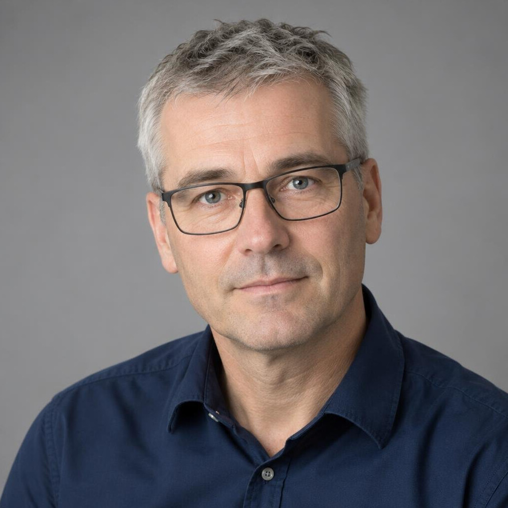 Portrait of a man with glasses and a beard